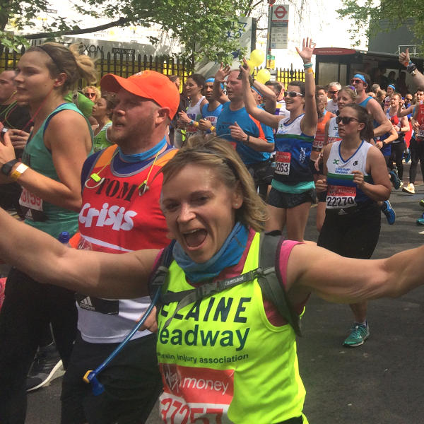 Elaine Murray cheers at the camera as she takes on the London Marathon for Headway